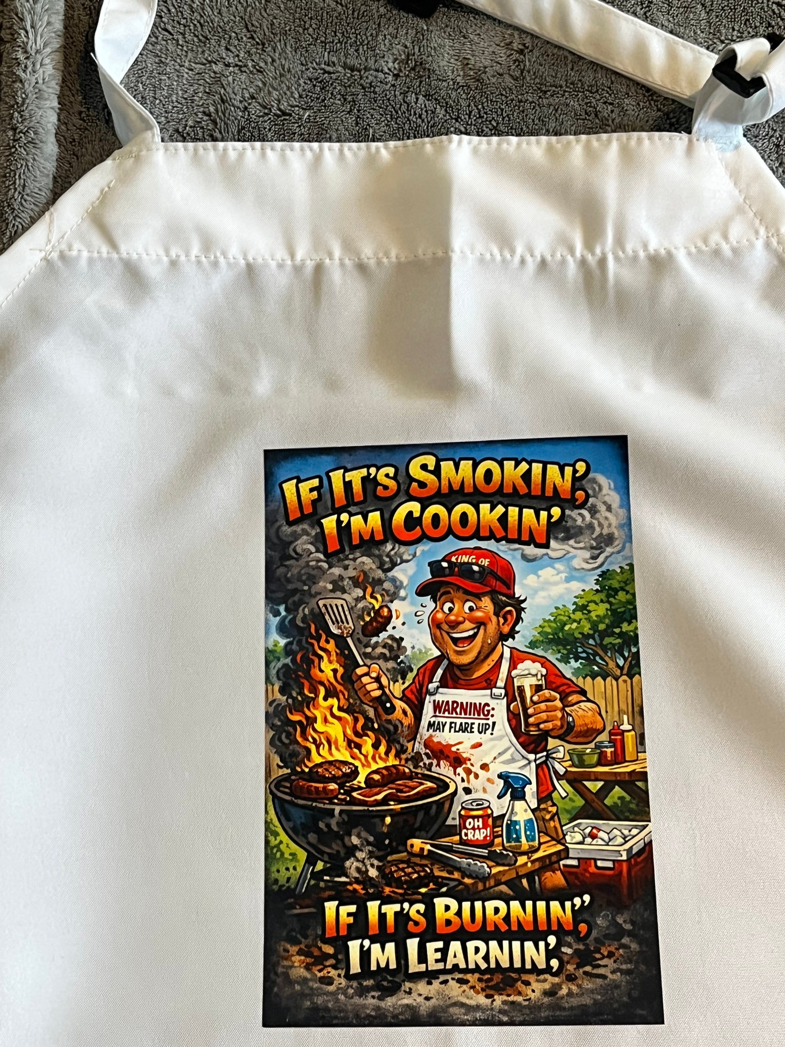 Funny BBQ Apron for Grill Masters – Smokin’ & Burnin’ Cartoon Grilling Apron – Backyard Barbecue Gift for Him